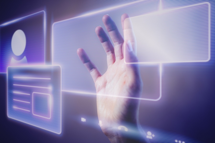 mão tocando uma interface holografica